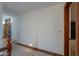 Hallway with carpet flooring and dark wood trim at 1520 E Elmwood Cir, Mesa, AZ 85203