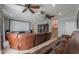 Home theater with large screen, projector, and reclining leather seating at 1520 E Elmwood Cir, Mesa, AZ 85203