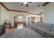 Open living room featuring carpet floors, a brick fireplace, and views into the foyer and kitchen at 1520 E Elmwood Cir, Mesa, AZ 85203