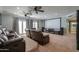 Home theater with a large screen, comfortable seating, and accent lighting for the ultimate viewing experience at 1520 E Elmwood Cir, Mesa, AZ 85203