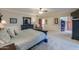 Spacious bedroom with neutral carpet, ceiling fan, and large dresser with mirror at 1520 E Elmwood Cir, Mesa, AZ 85203