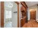 Butler's pantry with wooden cabinetry, granite countertops, and a window seat at 1520 E Elmwood Cir, Mesa, AZ 85203