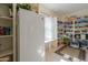 Walk-in pantry with ample storage space, shelving, and a second refrigerator at 1520 E Elmwood Cir, Mesa, AZ 85203
