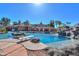 View of sparkling pool featuring rock accents and slide at 1520 E Elmwood Cir, Mesa, AZ 85203