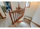 Carpeted staircase with decorative railing, leading up to the second floor at 1520 E Elmwood Cir, Mesa, AZ 85203