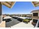 Scenic view from a condo balcony overlooking covered parking, pool, and desert landscape at 16615 E Gunsight Dr # 205, Fountain Hills, AZ 85268
