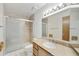 Well-lit bathroom featuring a tiled shower and granite vanity at 16615 E Gunsight Dr # 205, Fountain Hills, AZ 85268