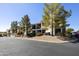 Attractive condo building with balconies, mature trees, and well-maintained landscaping for an inviting atmosphere at 16615 E Gunsight Dr # 205, Fountain Hills, AZ 85268