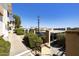 Inviting entrance to a community with lush landscaping, well-kept sidewalks, and convenient parking at 16615 E Gunsight Dr # 205, Fountain Hills, AZ 85268