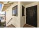 Close-up of a condo entrance with a security door and a small window with pleated blinds at 16615 E Gunsight Dr # 205, Fountain Hills, AZ 85268