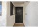 Inviting front door protected by a secure black security gate and a window to the side at 16615 E Gunsight Dr # 205, Fountain Hills, AZ 85268