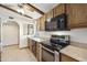 This kitchen features wood cabinets, stainless steel appliances and tile floors at 16615 E Gunsight Dr # 205, Fountain Hills, AZ 85268