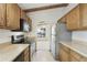 This kitchen features stainless steel appliances, tile floors and views to the living area at 16615 E Gunsight Dr # 205, Fountain Hills, AZ 85268