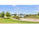 Scenic lake view with a large fountain in the distance and grassy lawns in the foreground at 16615 E Gunsight Dr # 205, Fountain Hills, AZ 85268