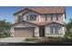 Beautiful two-story home with a tile roof, charming shutters, and a two car garage at 17152 W Oberlin Way, Surprise, AZ 85387