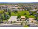 Overhead view of community park, with basketball court, sand volleyball, and picnic areas in a lush green space at 17254 W Marshall Ln, Surprise, AZ 85388