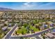 Aerial view of community featuring single-Gathering homes surrounded by green spaces and neighborhood streets at 17254 W Marshall Ln, Surprise, AZ 85388