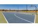 Community basketball court with vibrant blue and green surface, perfect for sports and recreational activities at 17254 W Marshall Ln, Surprise, AZ 85388
