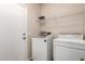Laundry room featuring a full size washer and dryer, and a wire rack at 17254 W Marshall Ln, Surprise, AZ 85388