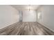 Spacious living room features wood-look flooring and a chandelier at 17254 W Marshall Ln, Surprise, AZ 85388