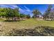 Inviting park featuring a picnic area nestled among mature trees and well-maintained greenery at 17254 W Marshall Ln, Surprise, AZ 85388