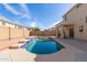 Private in-ground swimming pool features a tanning deck, tile accents, and concrete trim at 17254 W Marshall Ln, Surprise, AZ 85388