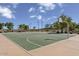 Outdoor basketball court with well maintained green surface and white lines at 18490 N Tanners Way, Maricopa, AZ 85138