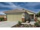 Charming single-story home featuring a tile roof and a two-car garage at 18490 N Tanners Way, Maricopa, AZ 85138