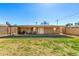 Large backyard with a covered patio, ideal for gatherings and enjoying the outdoor space at 1926 E Clarendon Ave, Phoenix, AZ 85016