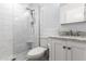 Bathroom with a glass shower, marble countertops, and white cabinets for a clean aesthetic at 1926 E Clarendon Ave, Phoenix, AZ 85016