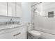 Bright bathroom featuring a white vanity with marble countertop and a glass-enclosed shower at 1926 E Clarendon Ave, Phoenix, AZ 85016