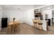 Open dining area next to a breakfast bar and kitchen, filled with natural light and clean accents at 1926 E Clarendon Ave, Phoenix, AZ 85016