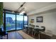 Modern dining room with city views, contemporary lighting, and seating for six at 200 W Portland St # 1217, Phoenix, AZ 85003