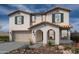 Beautiful two-story home with a tile roof, landscaped front yard, and a two-car garage at 21165 E Canary Way, Queen Creek, AZ 85142