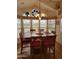 Inviting dining room with a large window view, modern furnishings, and hardwood floors at 2260 S Seminole Dr, Apache Junction, AZ 85119