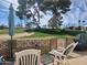 Relax on the patio with golf course views and mature palm trees at 2260 S Seminole Dr, Apache Junction, AZ 85119