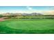 The golf course and well-manicured lawns offer beautiful views and endless entertainment at 22988 W Twilight Trl, Buckeye, AZ 85326