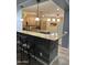 Kitchen featuring an island, breakfast bar, wooden cabinets, and modern appliances at 22988 W Twilight Trl, Buckeye, AZ 85326