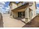 An inviting backyard features a covered patio with seamless access to indoor living spaces at 23764 N 162Nd Ave, Surprise, AZ 85387