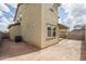 View of a backyard with a covered patio, showcasing the home's exterior features at 23764 N 162Nd Ave, Surprise, AZ 85387