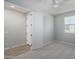 Bedroom featuring neutral carpet and a closet with double doors and white trim at 23764 N 162Nd Ave, Surprise, AZ 85387