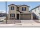 Charming two-story home with brown tiled roof, desert landscaping, and a two-car garage at 23764 N 162Nd Ave, Surprise, AZ 85387