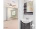 Bathroom view featuring sink, vanity and decorative shelves at 2441 E Edgemont Ave, Phoenix, AZ 85008