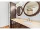 Bathroom with dual sinks and framed mirrors at 2441 E Edgemont Ave, Phoenix, AZ 85008