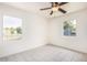 Bright bedroom with tile floors and two windows at 2441 E Edgemont Ave, Phoenix, AZ 85008