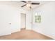 Bedroom with carpeted floor, closet, ceiling fan and a window for natural light at 2441 E Edgemont Ave, Phoenix, AZ 85008