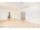 The living room boasts an open layout, bright lighting, fresh paint, and pristine tile flooring at 2441 E Edgemont Ave, Phoenix, AZ 85008