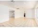 A spacious living room provides an open floorplan with ample natural light and a large window at 2441 E Edgemont Ave, Phoenix, AZ 85008