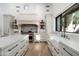 Well-appointed kitchen with white cabinetry, stainless steel appliances, and ample counter space at 27914 N 100Th Pl, Scottsdale, AZ 85262