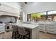 Bright and airy kitchen with custom white cabinetry and high-end appliances at 27914 N 100Th Pl, Scottsdale, AZ 85262